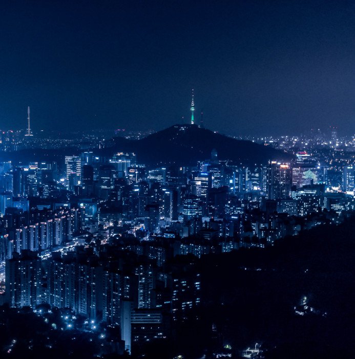 areal view with city during nighttime building light glow 2k