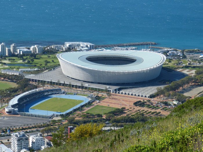 aerial photography of white stadium beside seashore at daytime 2k 4k