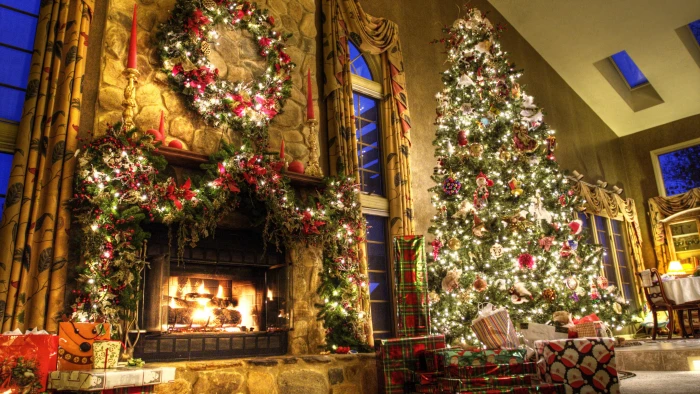 lighted green Christmas tree near fireplace new year 2k