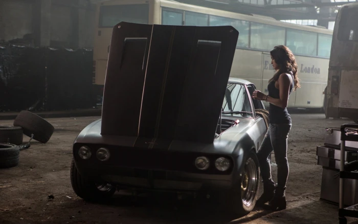 gray coupe machine background the film actress Michelle Rodriguez