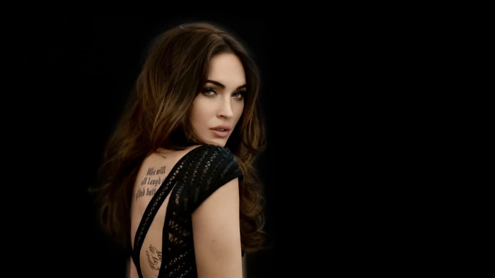 Megan Fox tattoo woman's black cap sleeved top actress look