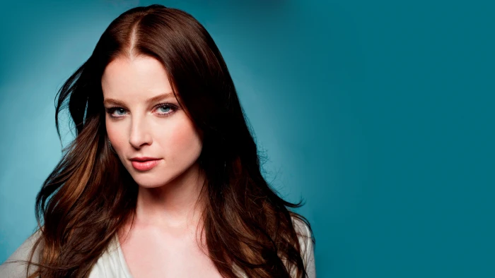 woman's face brunette actress Continuum blue background eyes 2k
