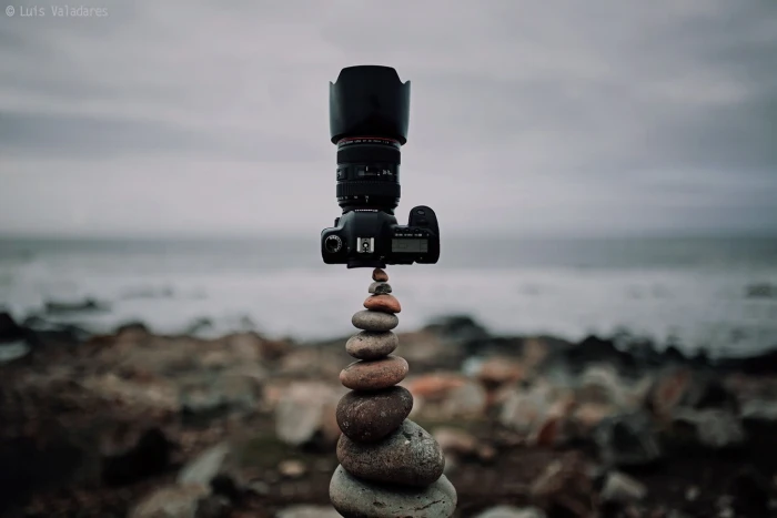 black DSLR camera photography nature symmetry rocks clouds
