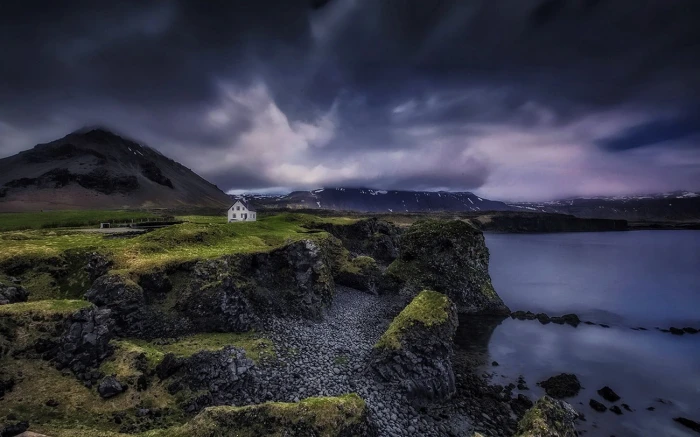 green grass nature landscape Iceland house clouds mountains