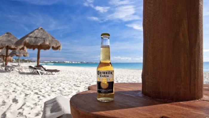 brown and black wooden table decor beer beach tropical sand 2k