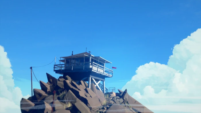 white baywatch tower gray house on top of brown stone fragment cloudy sky during daytime 2k