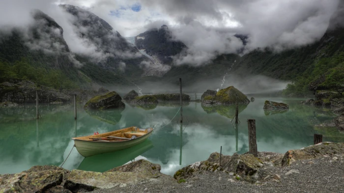 white paddle boat nature landscape water rock clouds Norway 2k