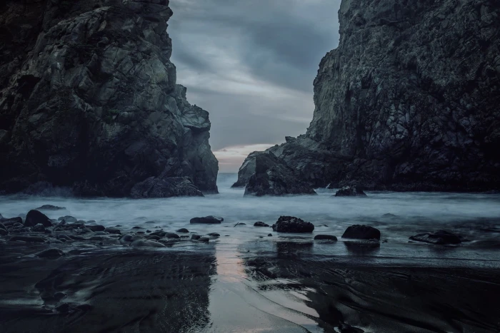 gray rocks beach sea water solid rock object beauty in nature 2k