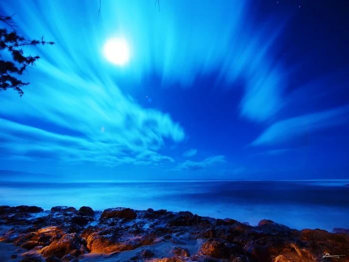 time lapse photography of sky and body water during night 2k