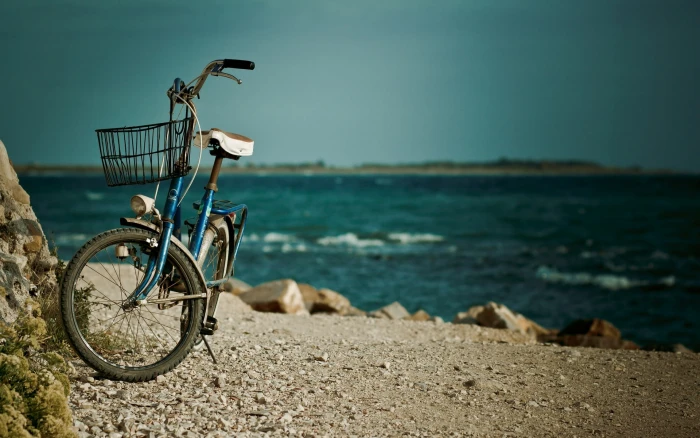 blue and white bicycle sea water bike river stones background 2k