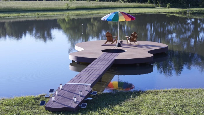 guitar shaped brown and beige dock with two aderondak patio umbrella 2k