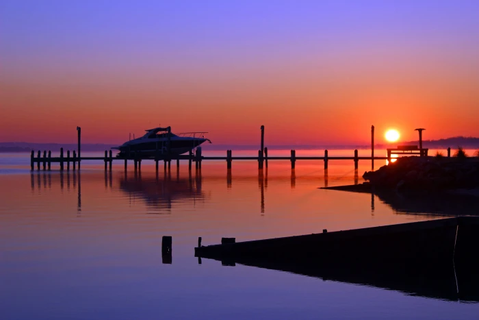 silhouette of boat on dock during sunset winter sunrise Patuxent River 2k