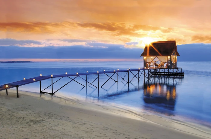 brown and black dock with restaurant beach horizon sea sky 2k