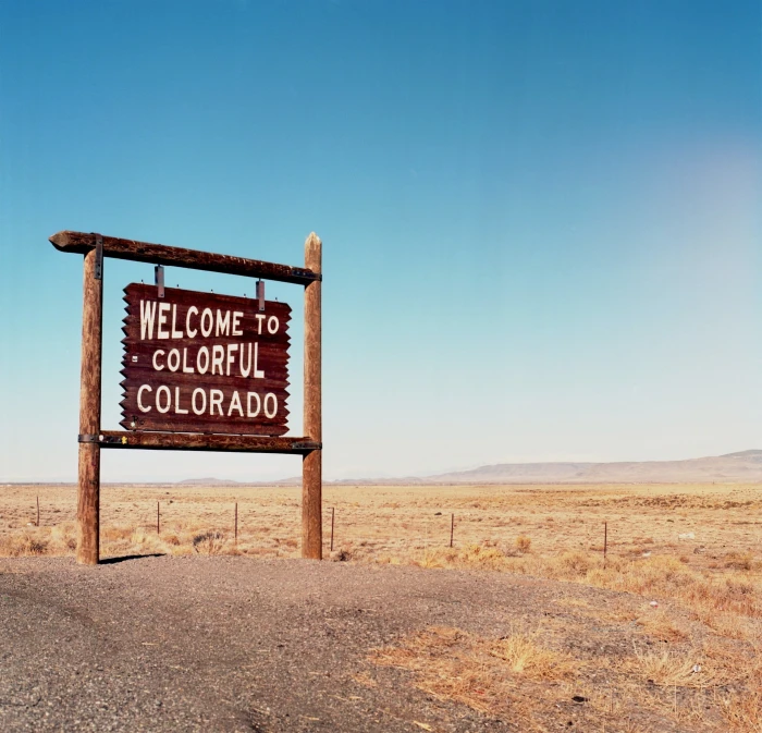 welcome to colorful Colorado signage signpost border tourism 2k