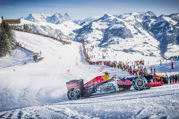 Redbull racing snow car near people on mountain Formula 1 2k