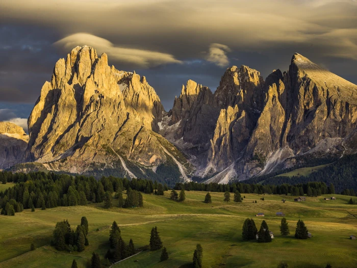 brown mountain and green field alpe di siusi italy nature 2k