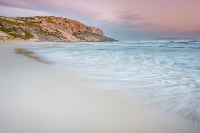 time lapse photography of beach during daytime white shore under gray sky 2k 4k