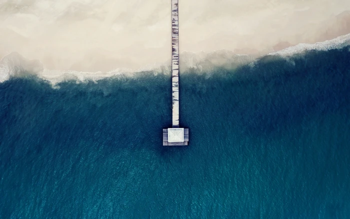 body of water sand beach sea aerial view pier blue Maldives 2k
