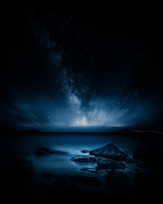 Beautiful night stars from the beach in france body of water during nighttime 2k 4k