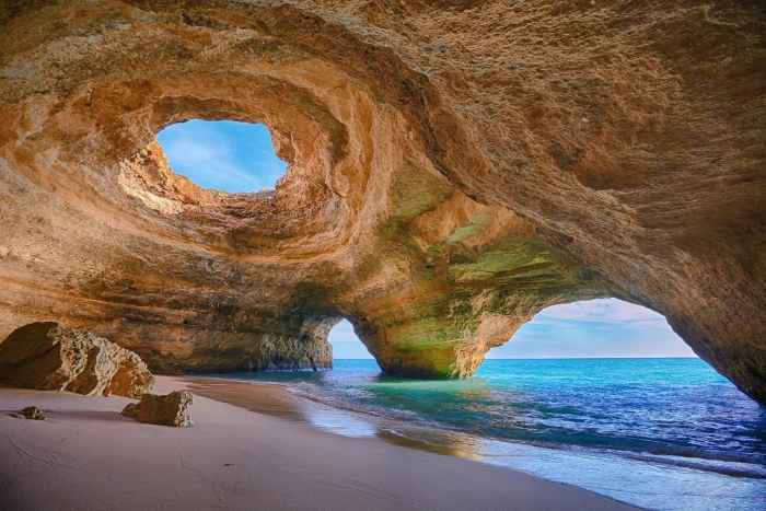 brown cave on shore nature sea beach rock formation 2k