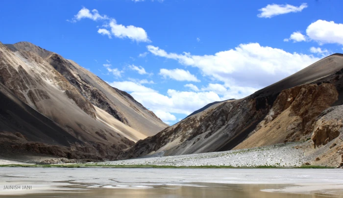 photography of white and brown mountain cloudy sky during daytime ladakh 2k
