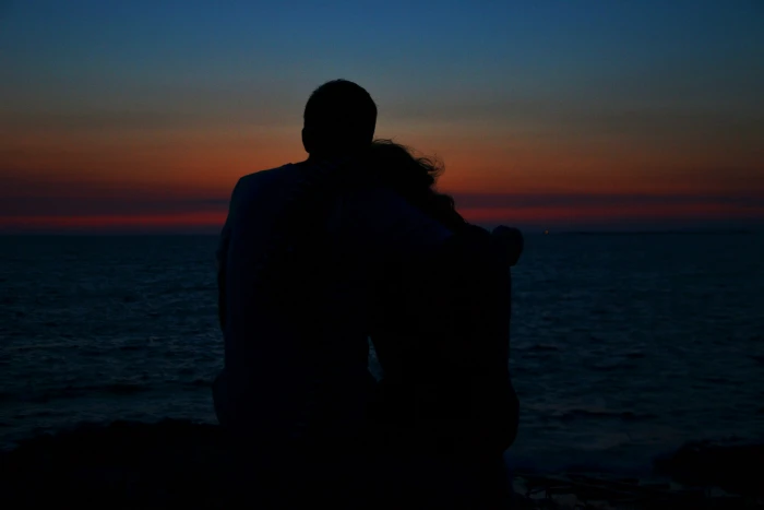 silhouette of man and woman during golden hour sunset pair 2k 4k 5k