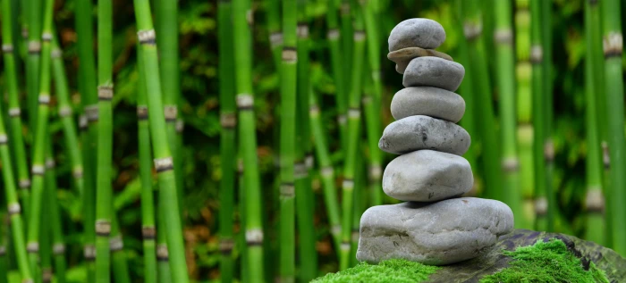 focus photo of cairn with bamboo trees background zen garden 2k 4k 5k