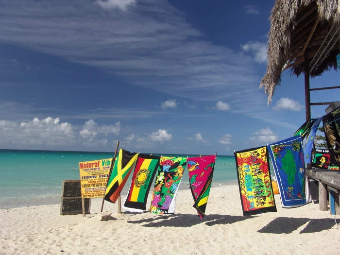 assorted color banner hangs near body of wter beach holiday 2k