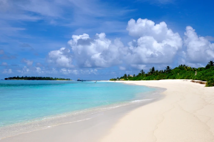 seashore under white clouds maldives beach sand summer island 2k 4k