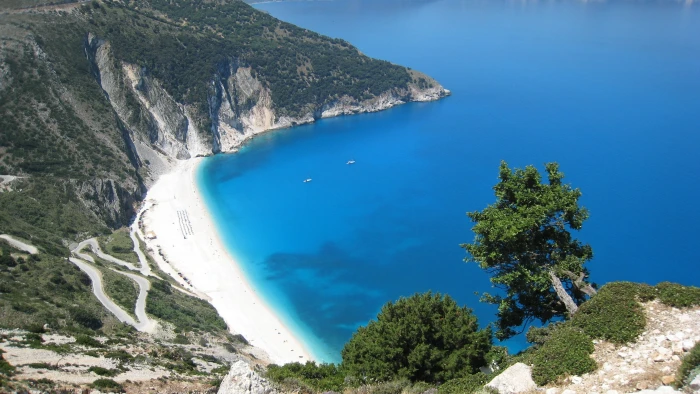 top angle photo of island surrounded by blue ocean water beach 2k