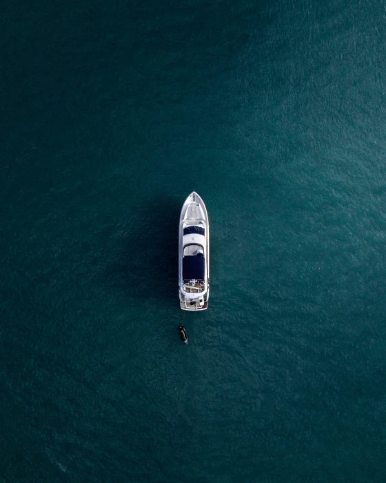 aerial photography of white yacht on calm waters view boat body water 2k