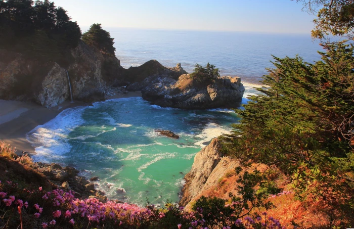 body of water and rock formation beach nature trees sea flowers 2k