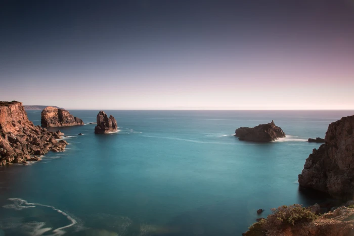 calm beach under rock formations and cliffs coast v 2 mm 2k 4k 5k