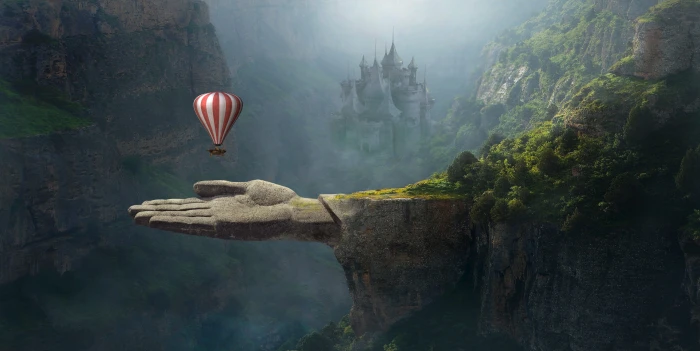 red and white striped hot air balloon above gray human hand mountain 2k 4k 5k