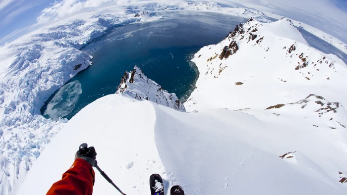 person on top of snow covered mountain holding ski stick 2k 4k 5k
