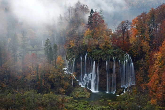 painting of falls and trees waterfalls near brown green 2k