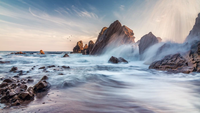 waterfalls in between rocks during daytime Corona Del Mar 2k 4k 5k