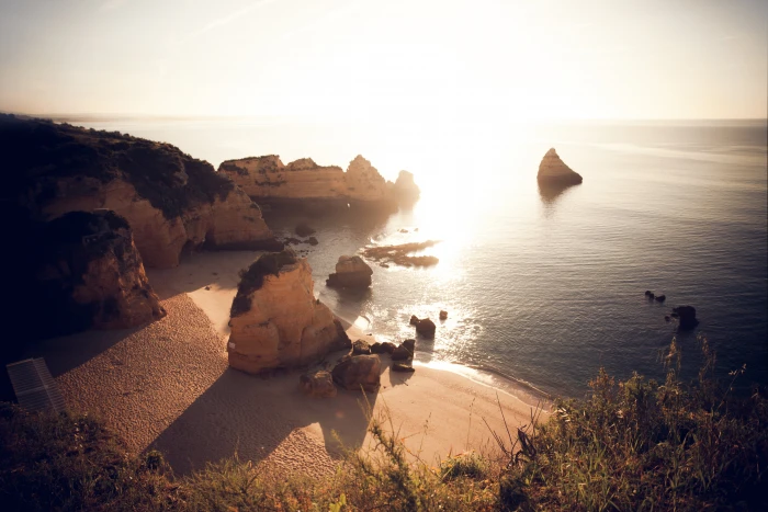 aerial photography of mountain beside seashore portugal lagos praia 2k 4k 5k