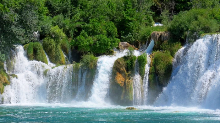 cascading waterfalls surrounded by forest river tree nature 2k 4k