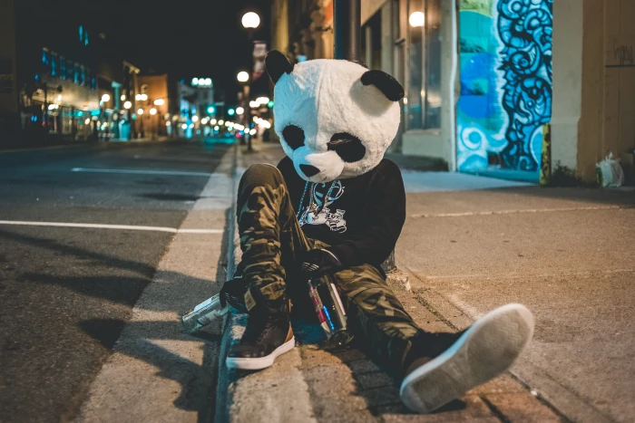 man wearing panda costume leaning on post person mask drunk 2k 4k 5k