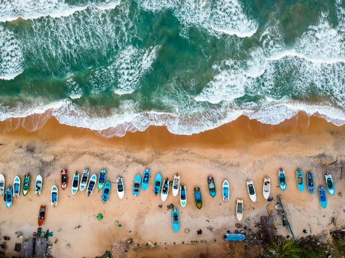 Aerial Photography of Boats on Shore aerial shot arigam bay 2k 4k