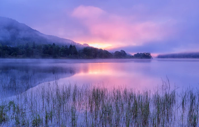 lake with mountain silhouette during golden hour loch achray 2k 4k 5k