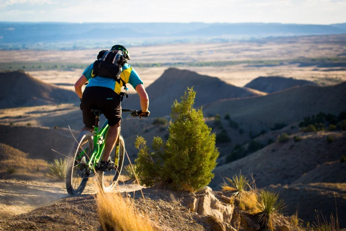 person riding green bike Dreamin mountain biking yeti summer 2k 4k 5k