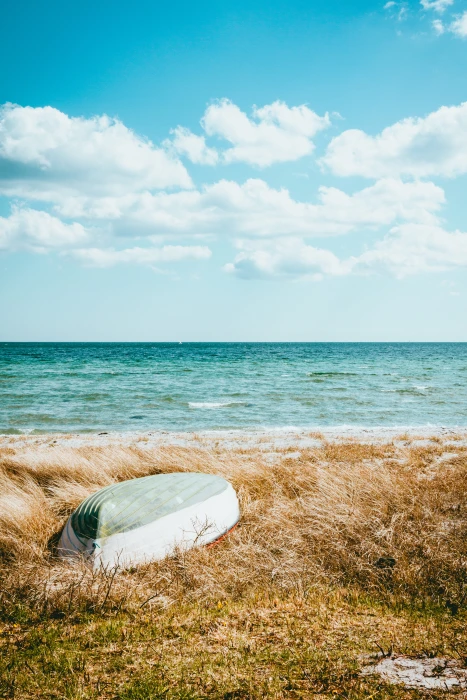 boat on beach under blue sky field seaside ocean horizon 2k