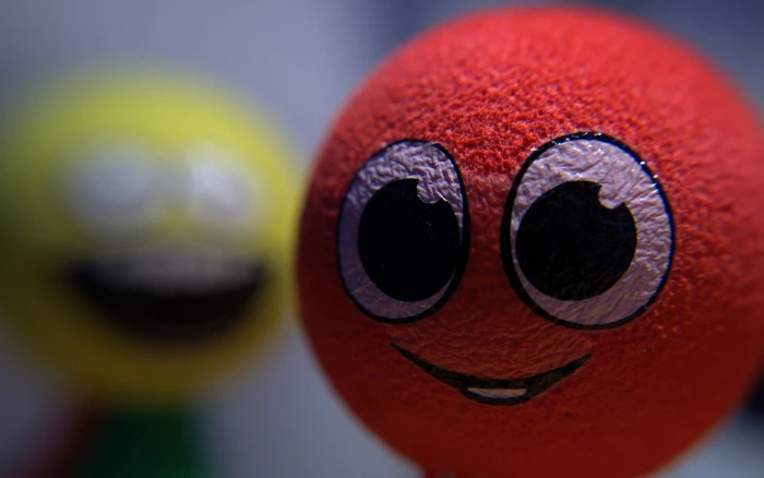 red emoji ball smiley blurred close up no people multi colored 2k