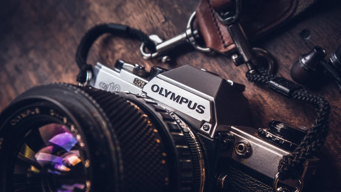 shallow focus photo of Olympus camera black and gray SLR macro shot 2k 4k 5k