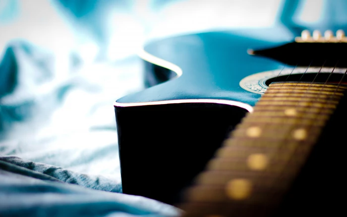 Blue delicate guitar background bokeh Ultra HD selective focus 2k 4k