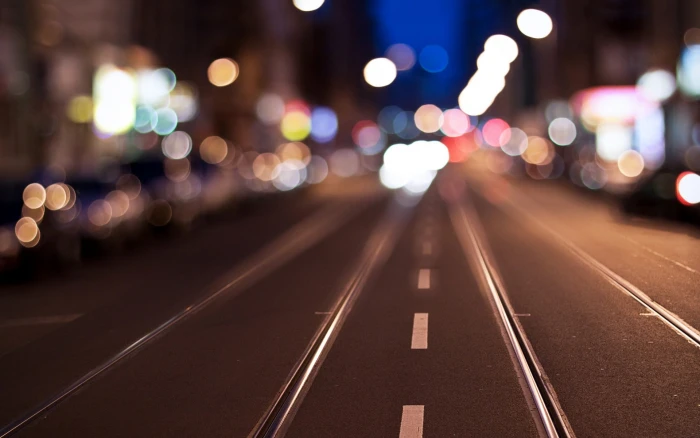 bokeh photography selective focus of black asphalt road 2k