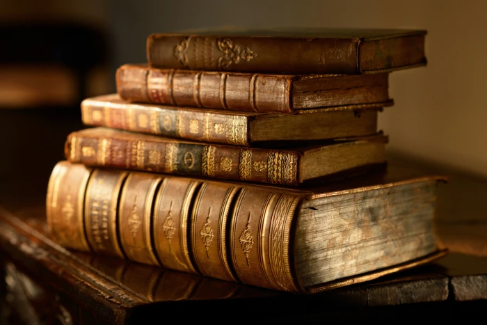 pile of brown books macro table blur stack vintage bokeh 2k 4k 5k