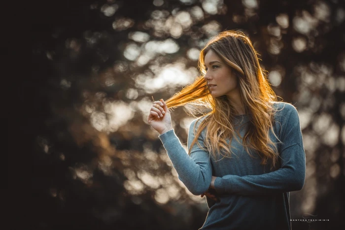 women s gray long sleeved top woman wearing sweatshirt standing during daytime 2k